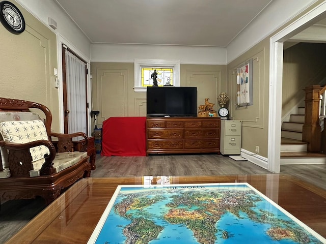 sitting room with wood-type flooring