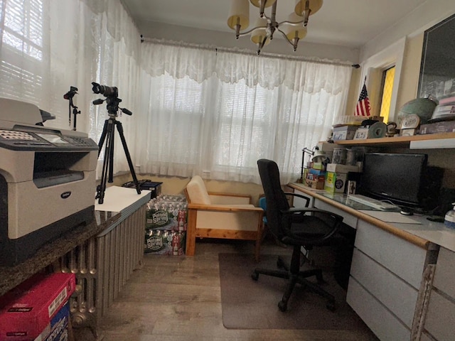 office area with hardwood / wood-style flooring and a notable chandelier