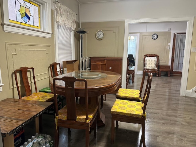 dining area with hardwood / wood-style flooring and plenty of natural light