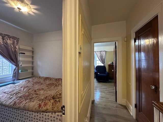 corridor with light hardwood / wood-style floors