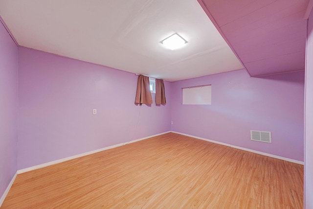 basement with wood-type flooring