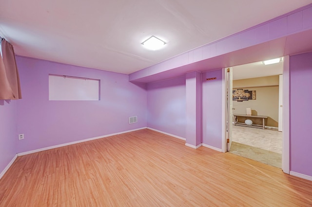 basement featuring hardwood / wood-style flooring