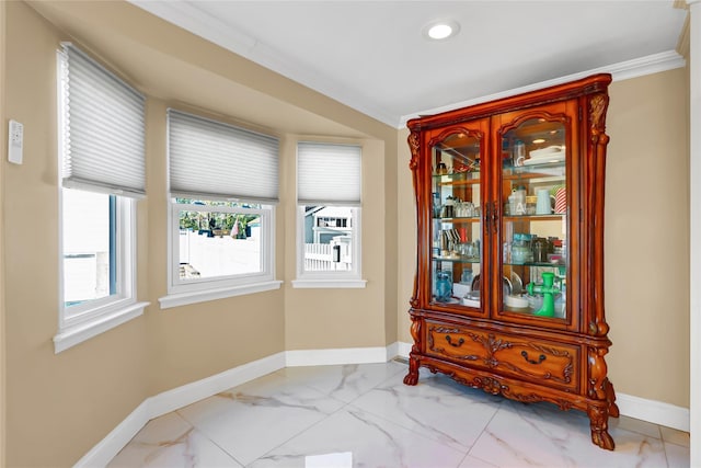 dining space with ornamental molding, recessed lighting, marble finish floor, and baseboards