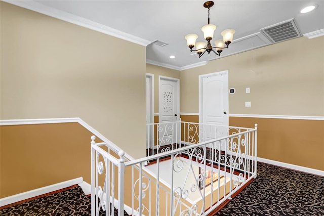 staircase featuring baseboards, visible vents, a chandelier, and crown molding