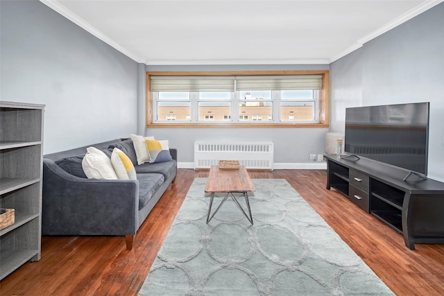 living room with crown molding, radiator heating unit, and dark hardwood / wood-style flooring