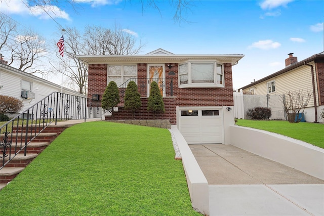 view of front facade with a garage and a front yard