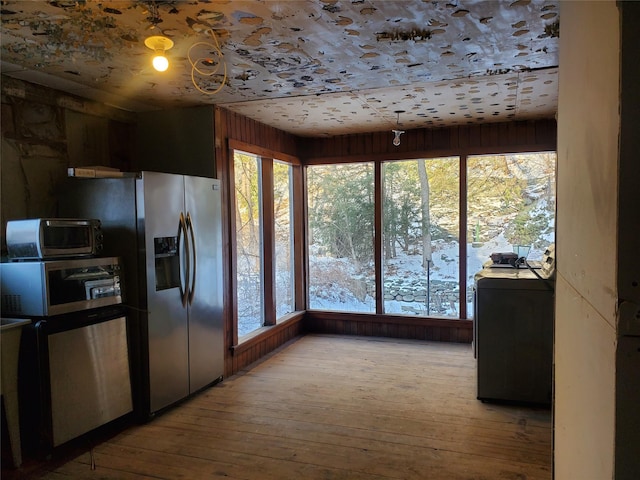 kitchen with light hardwood / wood-style flooring and stainless steel appliances