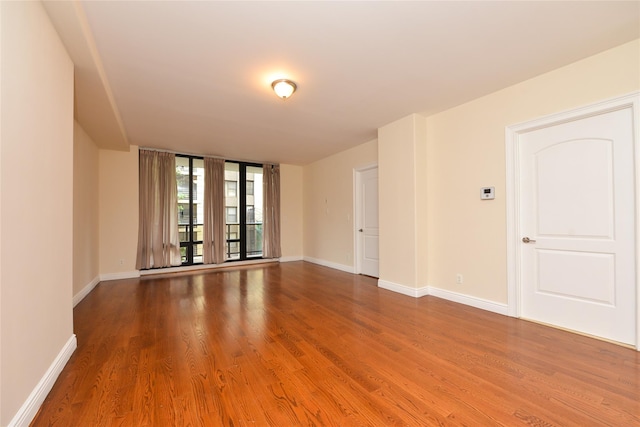 empty room featuring hardwood / wood-style flooring