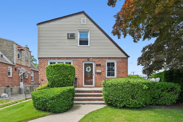 view of front of home with a front lawn