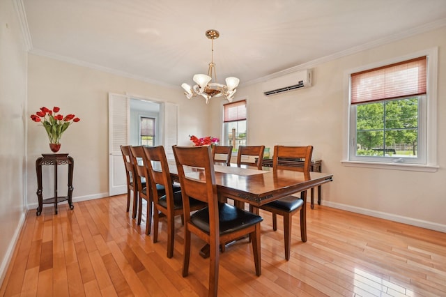 dining area featuring light wood-type flooring, a chandelier, a wall mounted AC, and crown molding