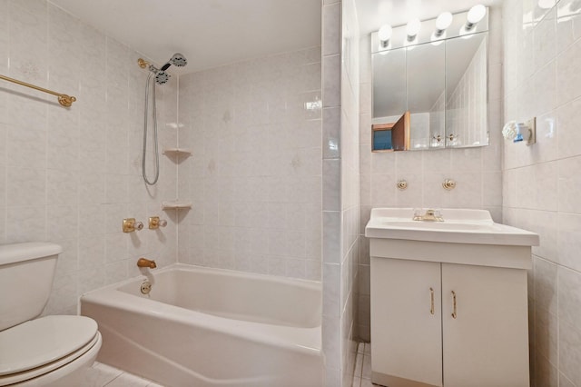 full bathroom featuring tile walls, tile patterned floors, vanity, and tiled shower / bath