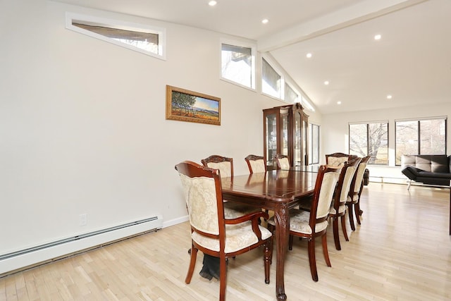 dining room with high vaulted ceiling, baseboard heating, light wood-type flooring, and beamed ceiling