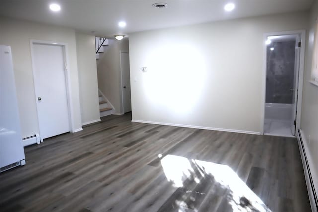 interior space featuring dark wood-type flooring and a baseboard radiator