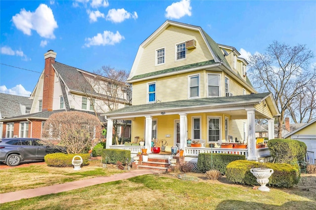 view of front of property featuring covered porch