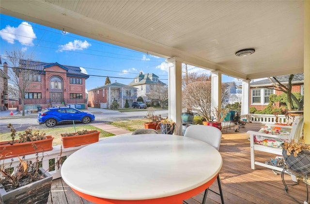 wooden terrace featuring covered porch