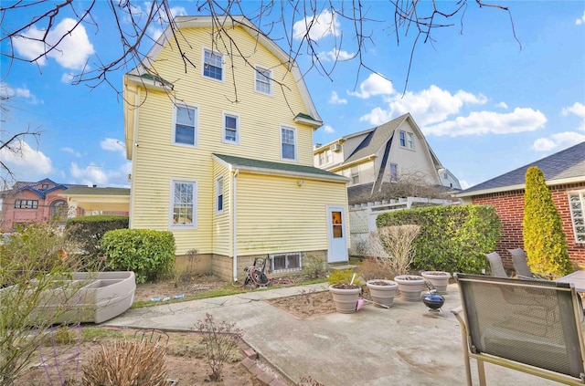 rear view of property with a patio area