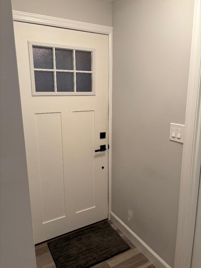 entryway with wood-type flooring