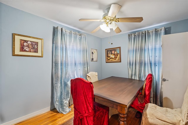 17718 Sayres Ave, Jamaica, NY 11433 - dining room featuring baseboards, light wood-style flooring, and a ceiling fan
