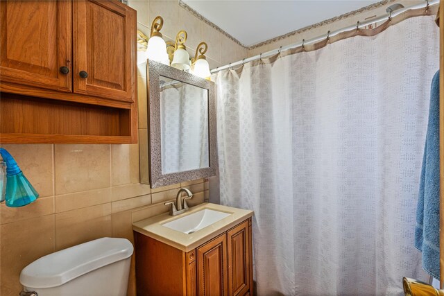 17718 Sayres Ave, Jamaica, NY 11433 - bathroom featuring toilet, vanity, a shower with shower curtain, and tile walls