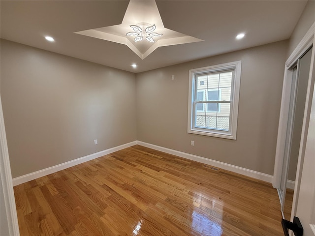 empty room with light hardwood / wood-style floors