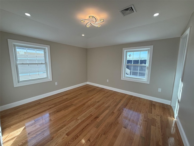 empty room with wood-type flooring