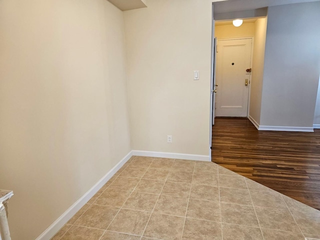 spare room featuring wood-type flooring