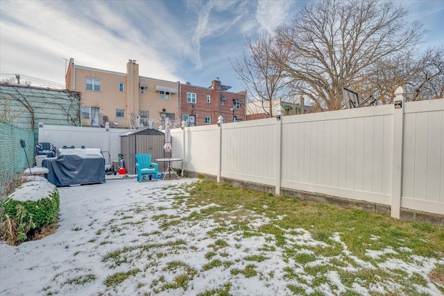 view of yard layered in snow