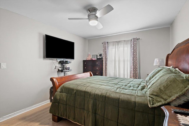 bedroom featuring wood-type flooring and ceiling fan