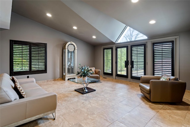 living room with french doors and lofted ceiling