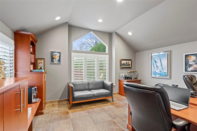 home office with lofted ceiling