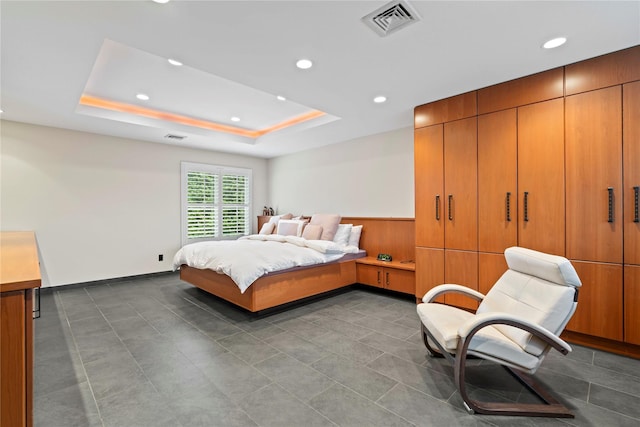 bedroom with a tray ceiling