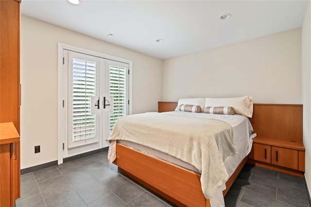 bedroom featuring access to exterior and wooden walls