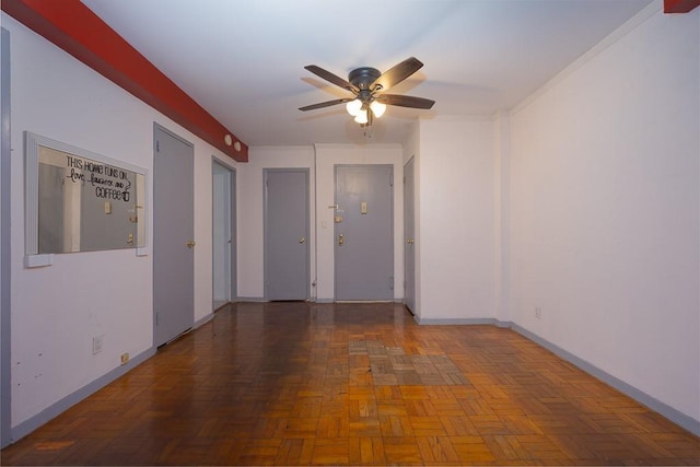 unfurnished room with parquet floors and ceiling fan