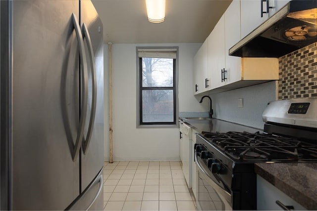 kitchen featuring white cabinets, sink, appliances with stainless steel finishes, and tasteful backsplash