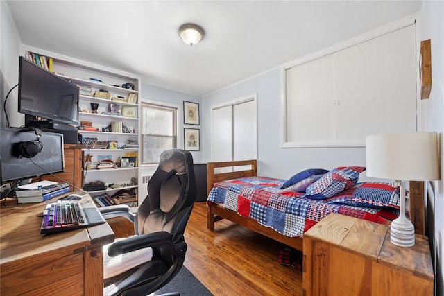 bedroom with hardwood / wood-style floors