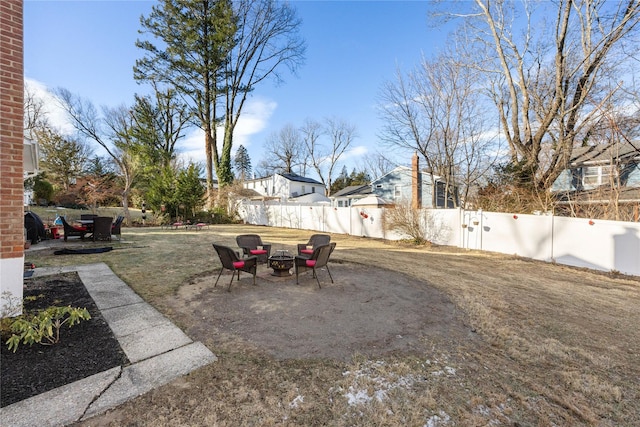 view of yard with an outdoor fire pit and a patio area