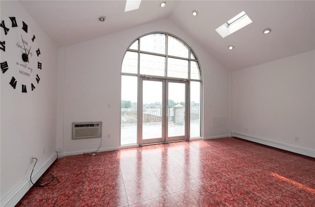 spare room featuring a baseboard radiator, an AC wall unit, high vaulted ceiling, and a skylight