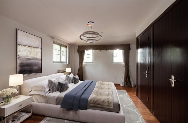 bedroom with light wood-type flooring