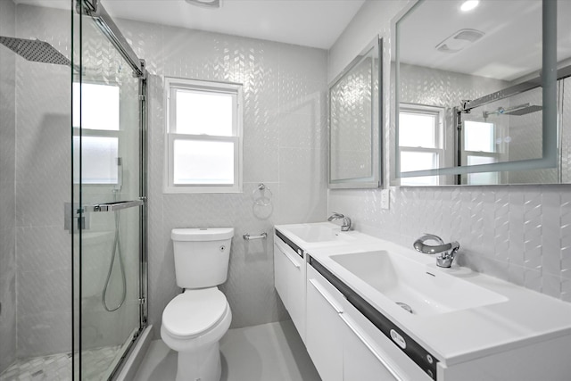 bathroom with plenty of natural light, toilet, backsplash, and vanity