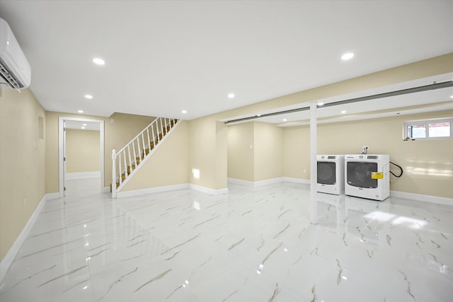 basement featuring washer and dryer and a wall unit AC