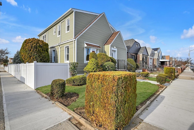 view of property exterior with a lawn