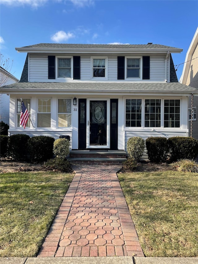 view of front facade with a front lawn