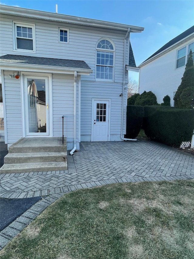 back of property featuring a patio area