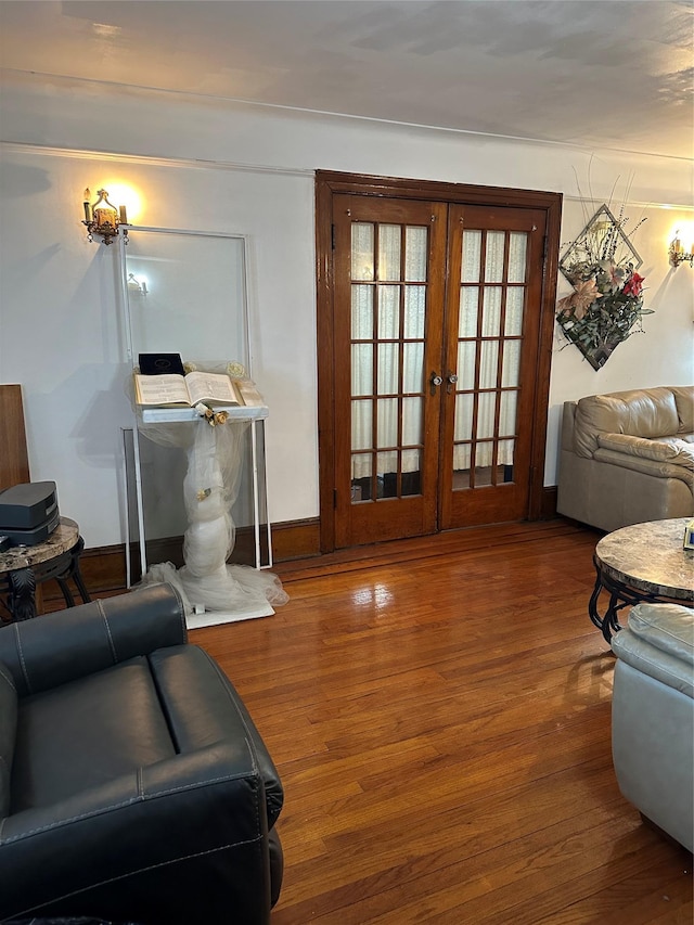 living room featuring wood-type flooring and french doors