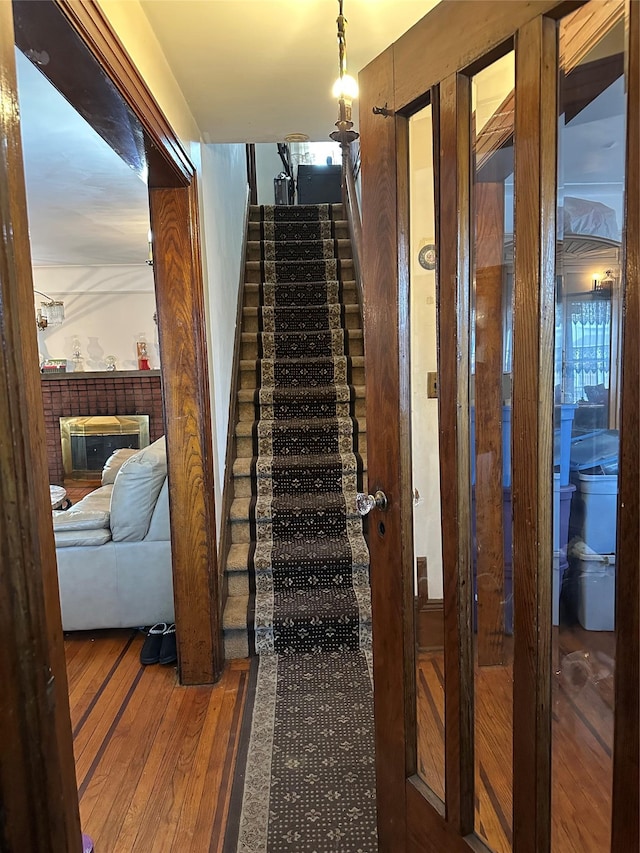 stairs with hardwood / wood-style flooring