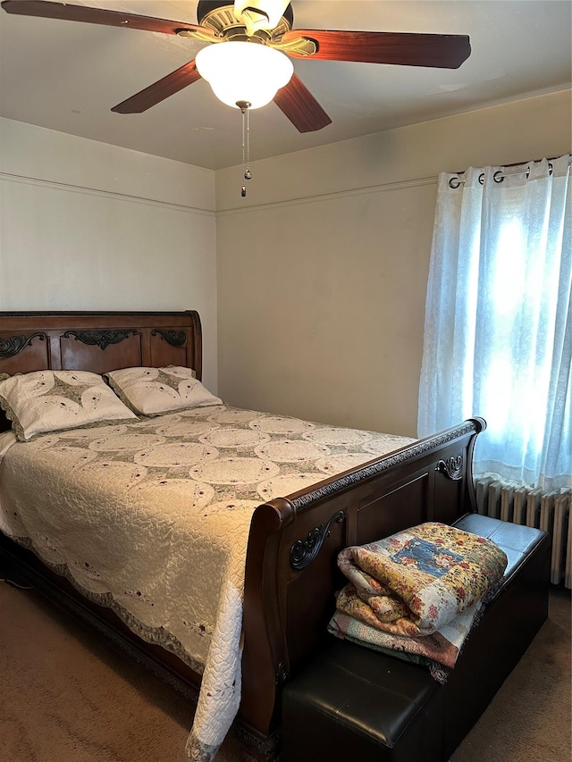 bedroom featuring carpet flooring, ceiling fan, and radiator