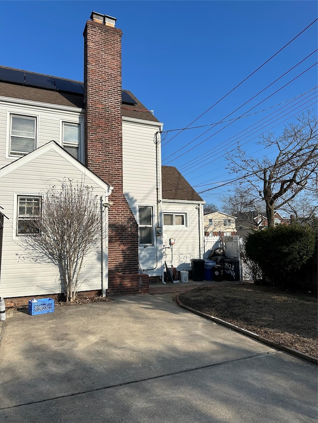 view of home's exterior with solar panels