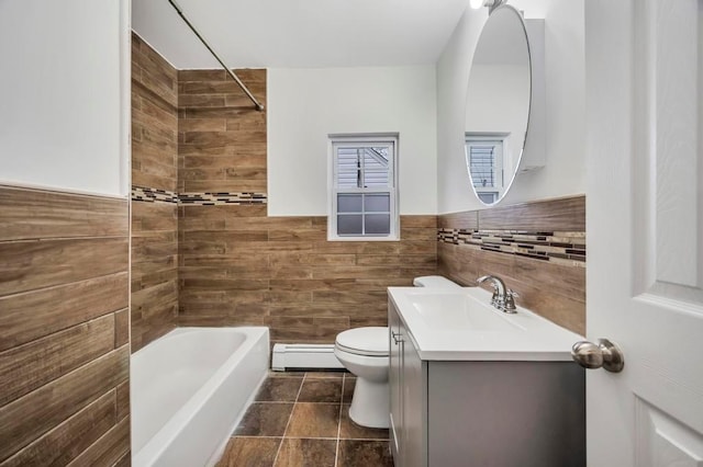 full bathroom with toilet, vanity, tile walls, and baseboard heating