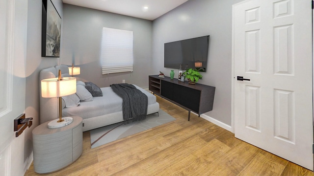 bedroom with light hardwood / wood-style flooring