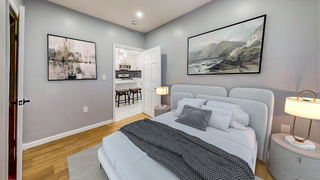 bedroom with light hardwood / wood-style flooring